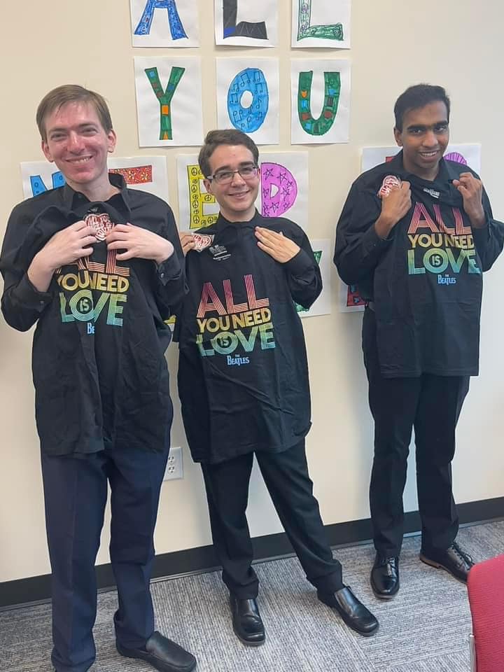 Students in matching concert shirts, full of joy