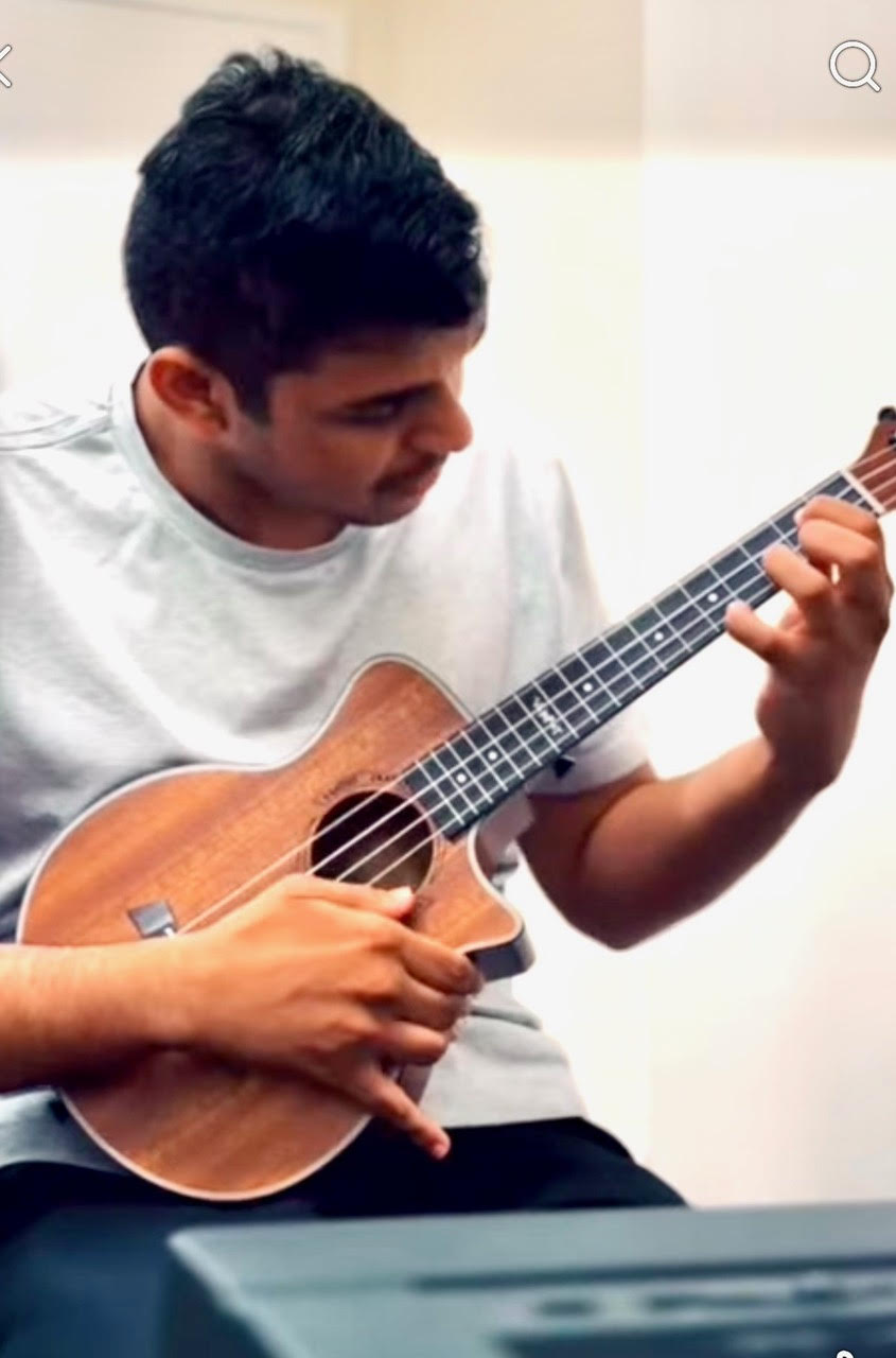 Sidd playing guitar