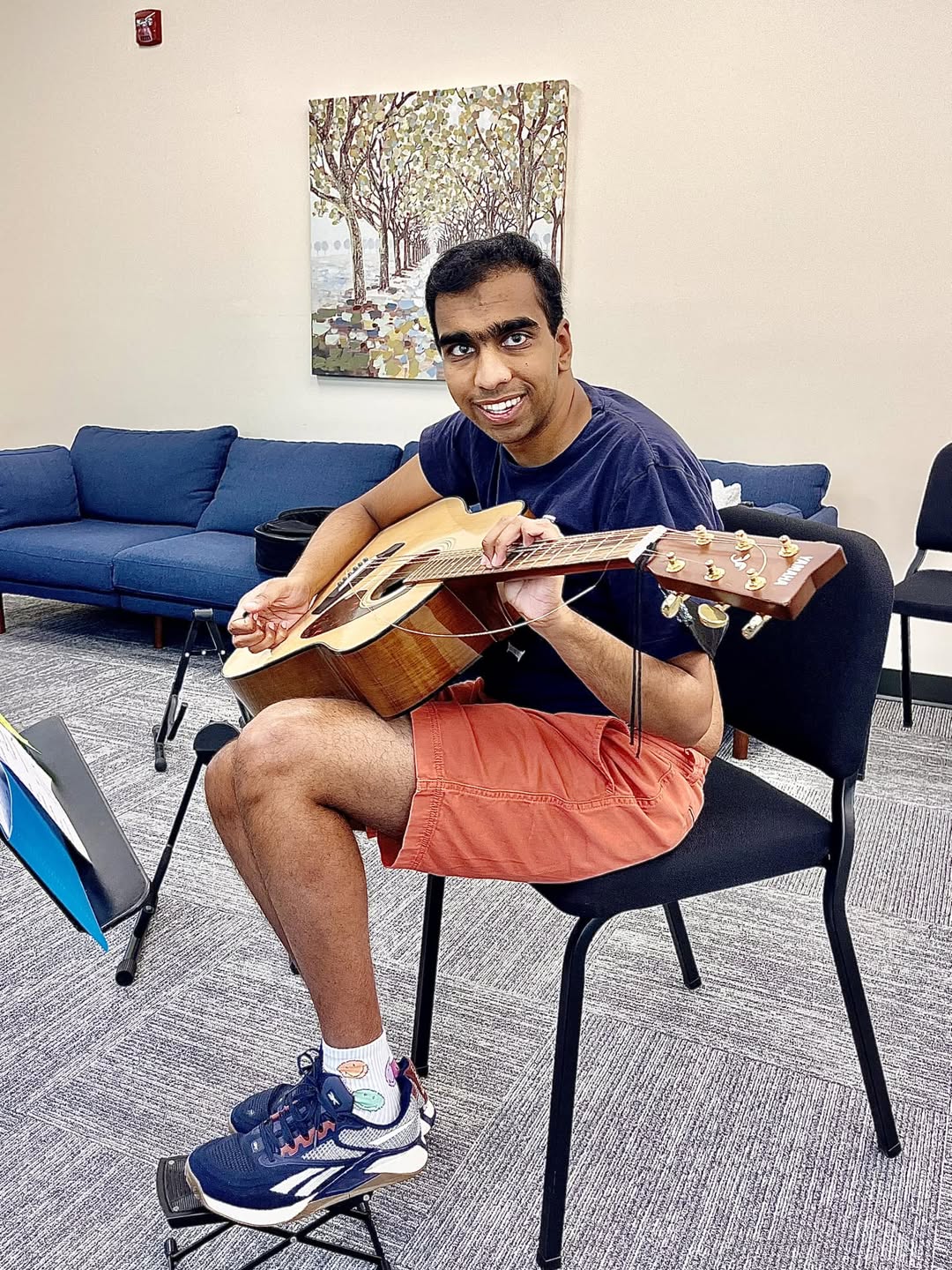 Student with guitar, candid moment